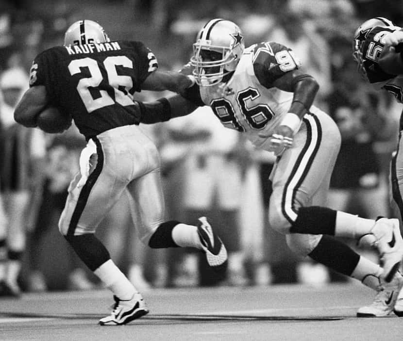 8/6/95---Dallas Cowboys defensive end  Shante Carver (96) runs down Oakland Raiders...