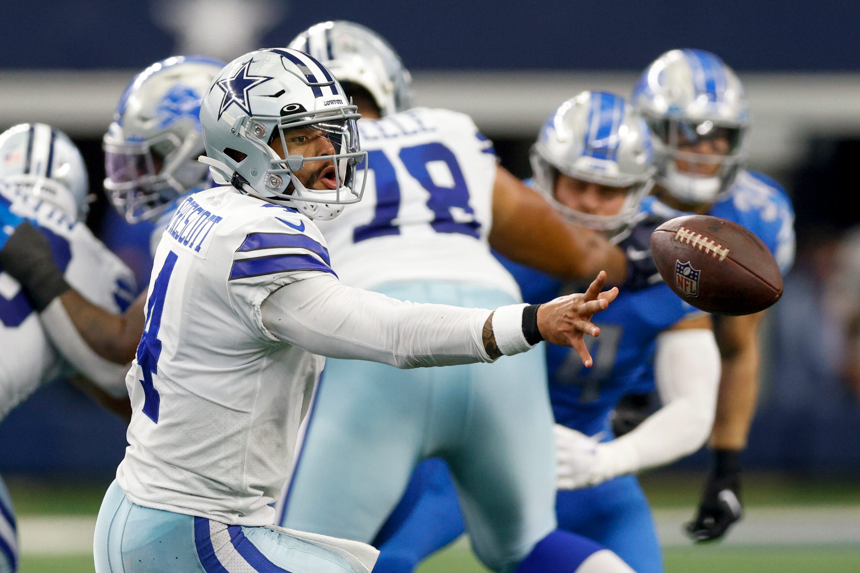 Dallas Cowboys quarterback Dak Prescott (4) pitches the ball during the first half of a NFL...