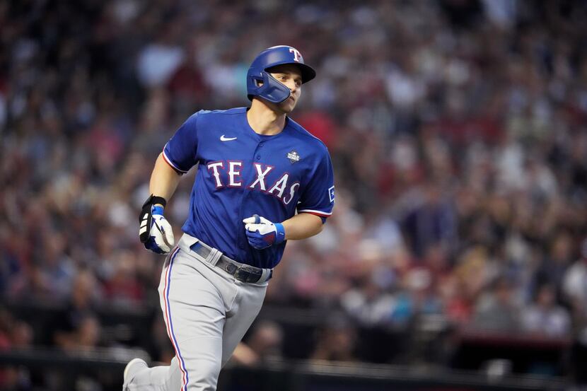 Texas Rangers’ Corey Seager (5) rounds the bases after hitting a two-run home run during the...