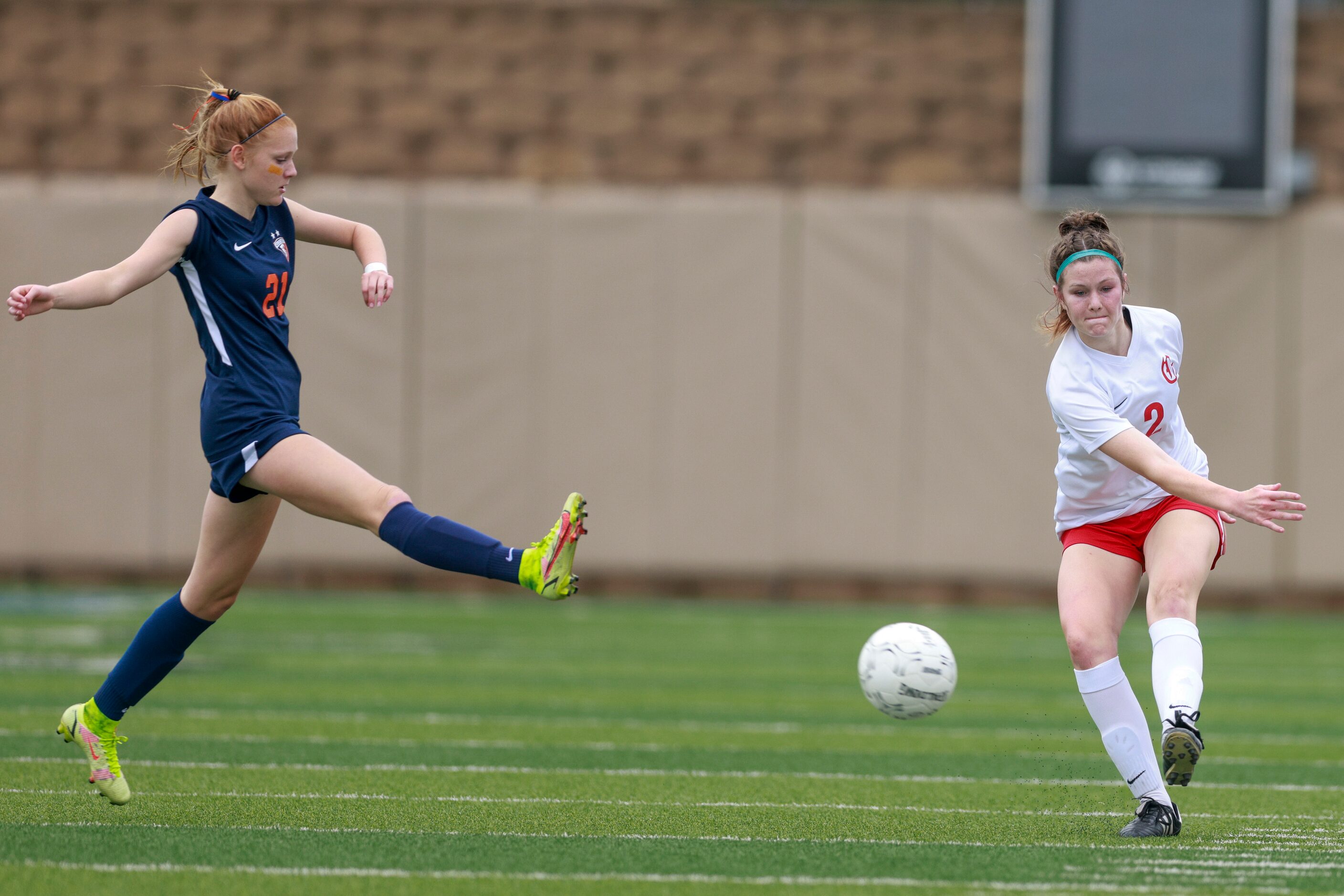 Grapevine defender Rowan Truman (2) passes the ball ahead of a defending Frisco Wakeland...