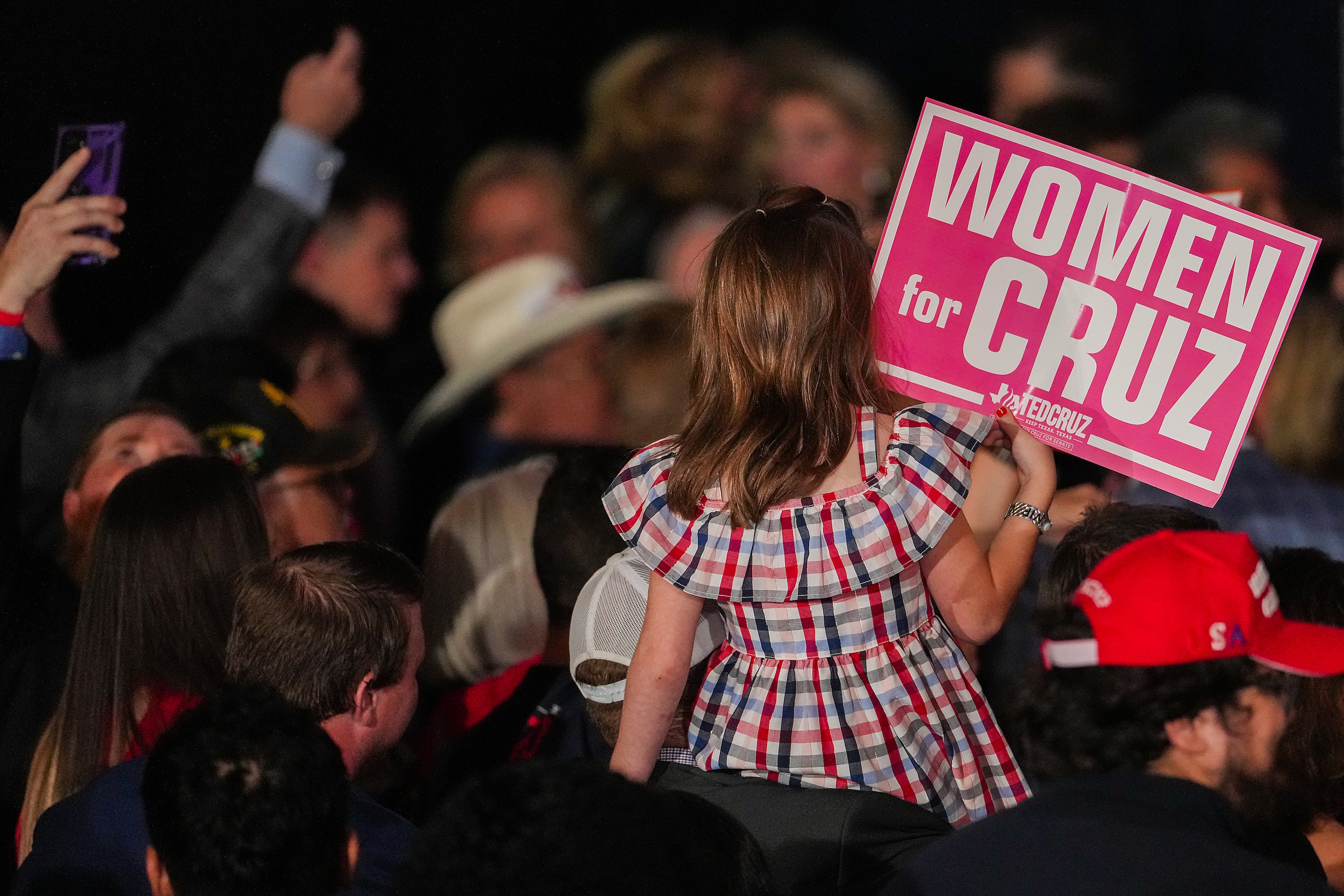 A youngster holds a sign in support of Sen. Ted Cruz, R-Texas, during an election night...