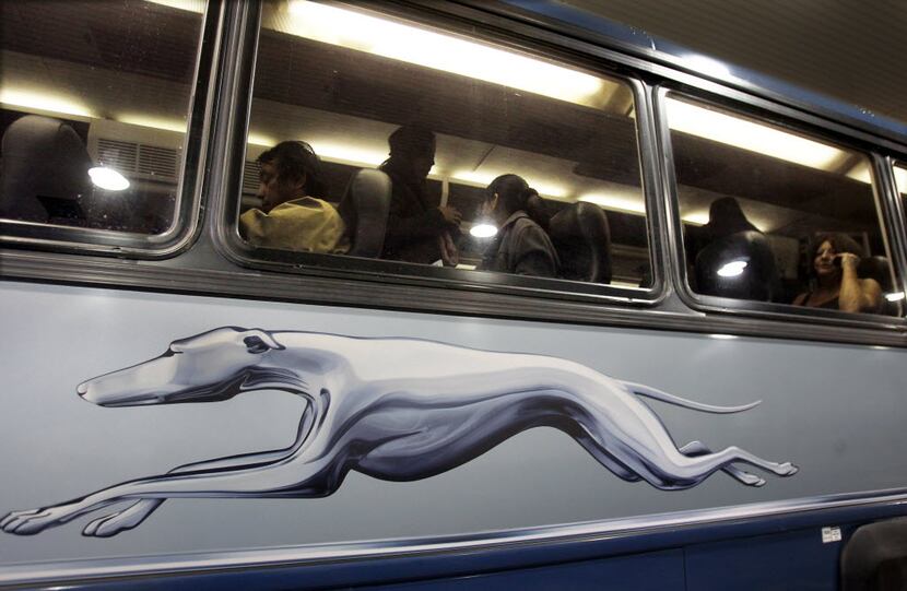 Passengers settle in aboard Greyhound's new Dallas-Houston express bus at the station on...