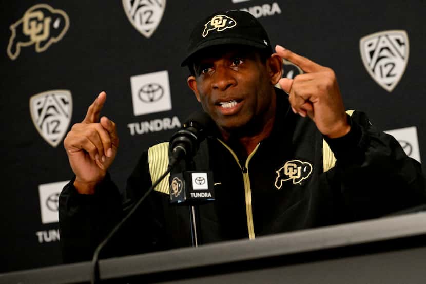 Colorado Buffaloes head football coach Deion Sanders speaks to members of the media about...