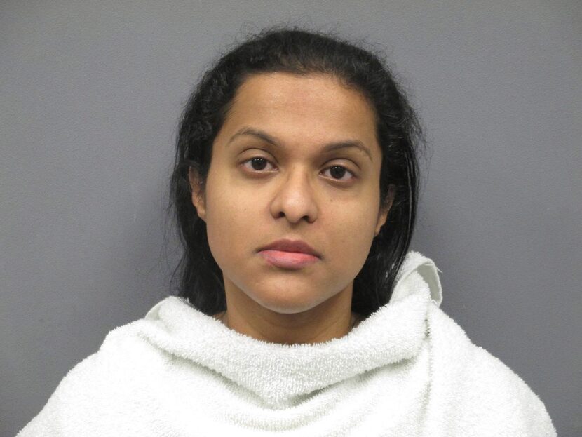 A booking photo of Sini Mathews