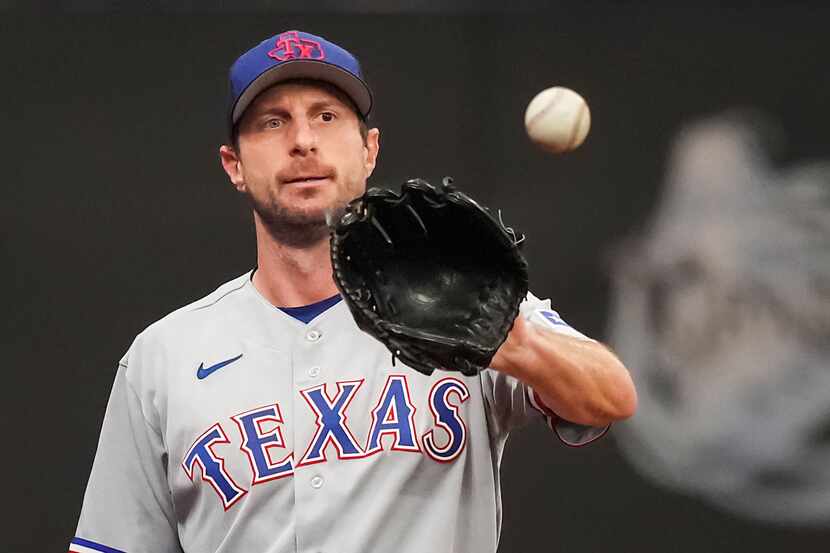 Texas Rangers pitcher Max Scherzer throws in the bullpen before an American League Wild Card...