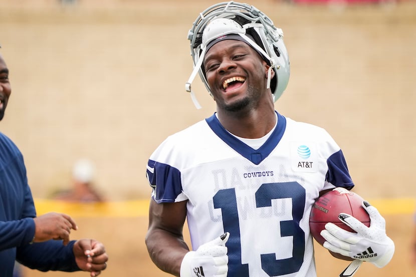 Dallas Cowboys wide receiver Michael Gallup smiles on the sidelines during a practice at...