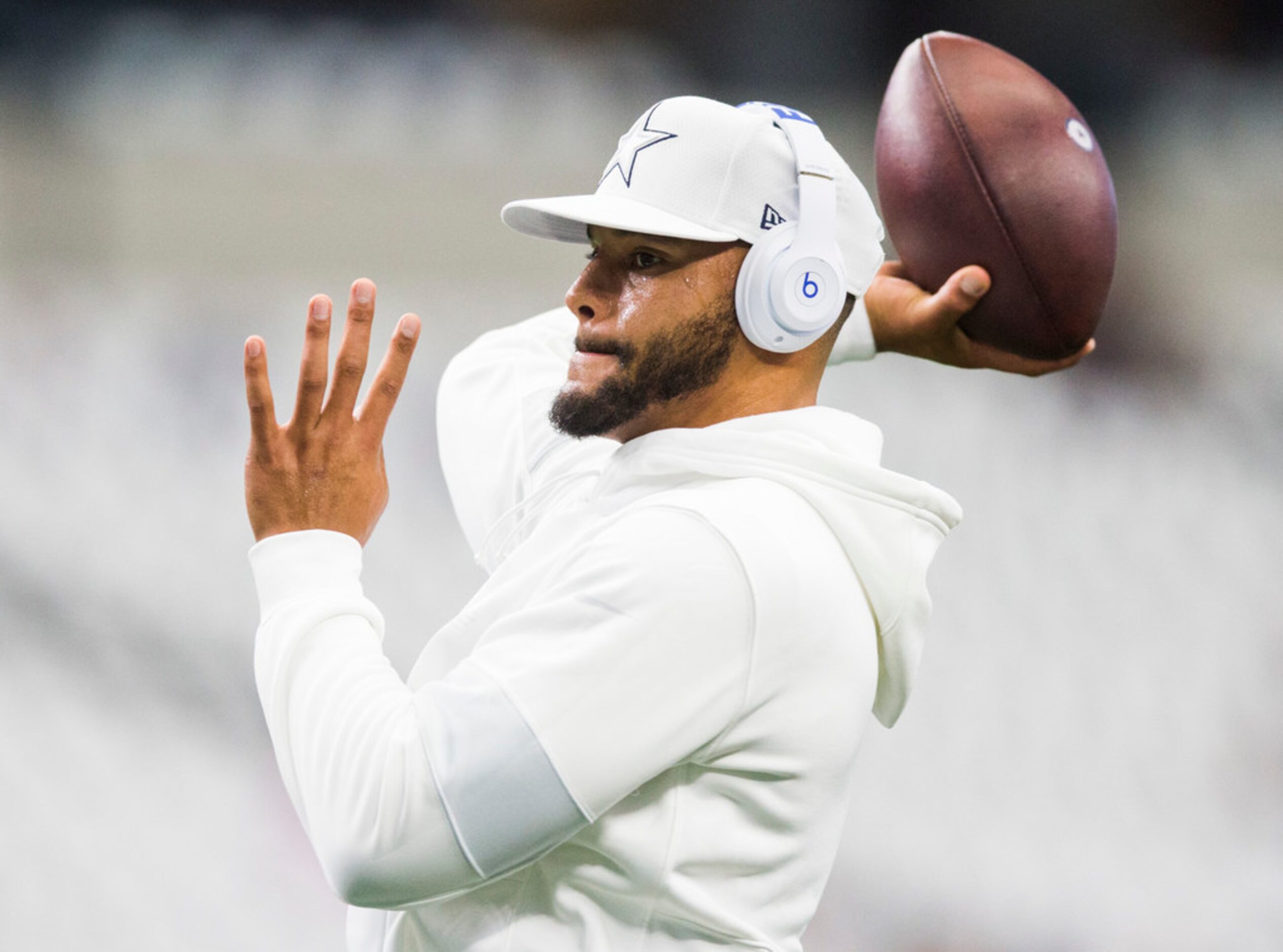 Dallas Cowboys quarterback Dak Prescott (4) warms up before an NFL game between the New York...