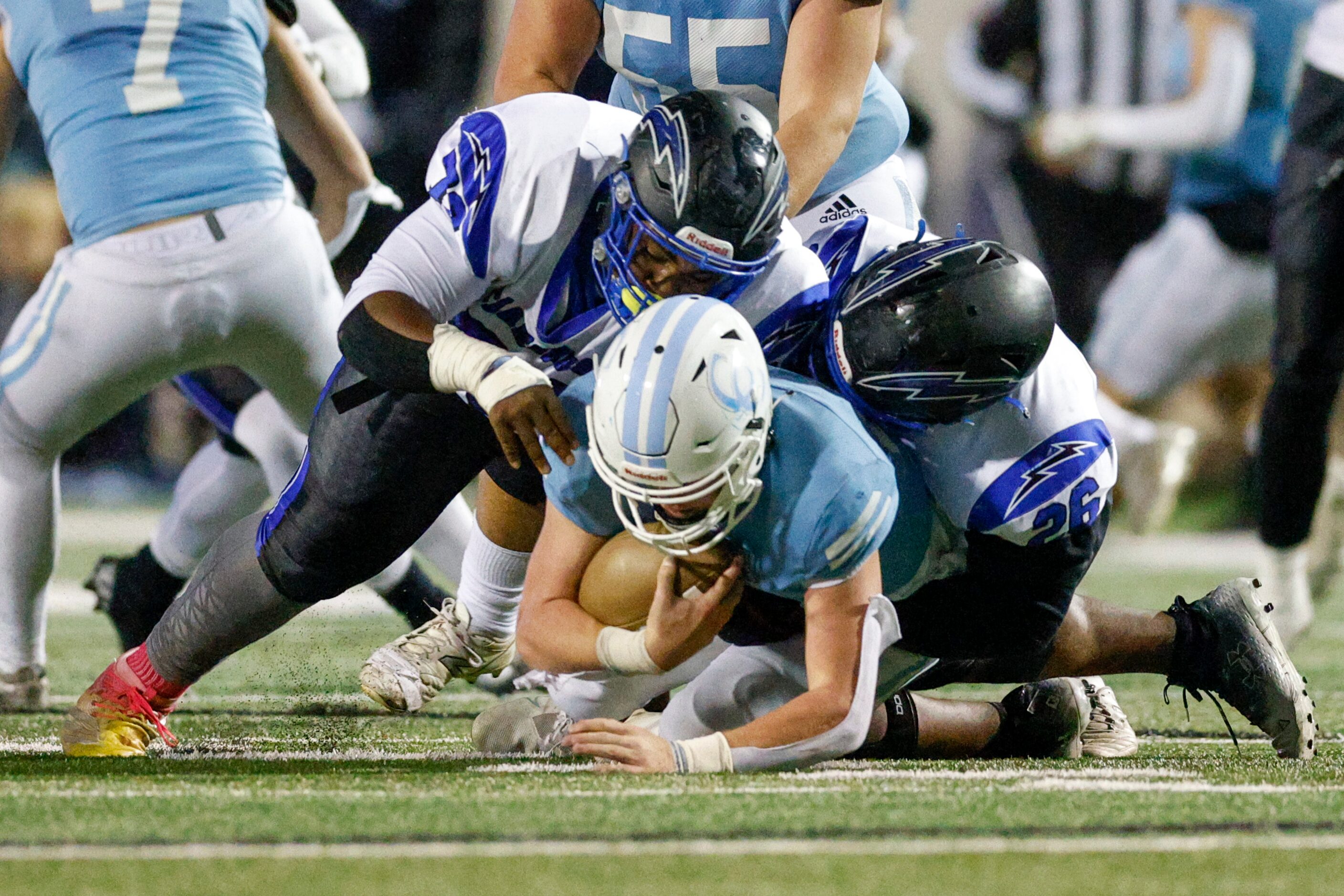 Dallas Christian defensive lineman Devontay High (79) and linebacker Phillip Bazemore (26)...