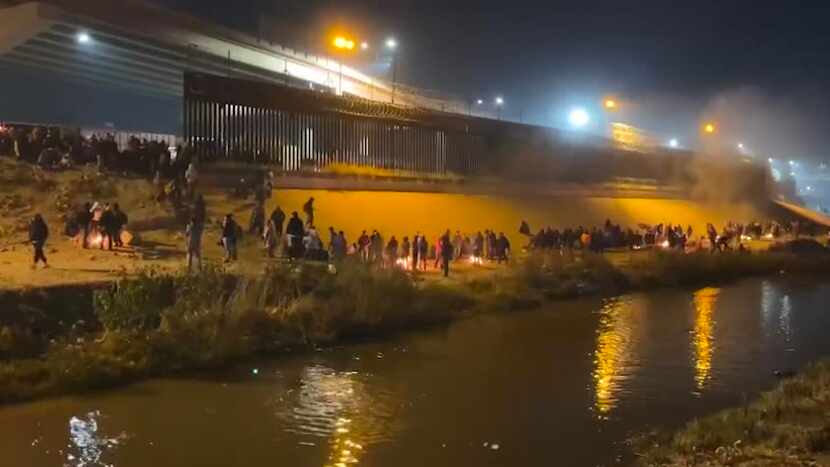 Migrants gathered in El Paso along the Rio Grande on Dec. 19, 2022. Biden’s humanitarian...