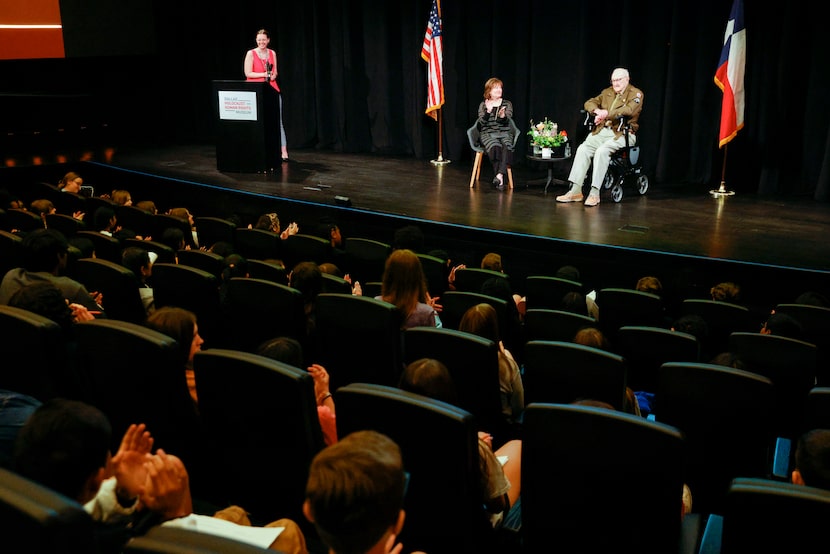 Students applaud after WIlliam "Bill" Kongable spoke during a presentation alongside...