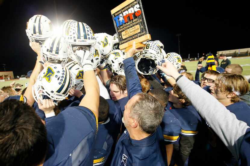 The Plano Prestonwood Christian football team celebrates after winning the TAPPS Division I...