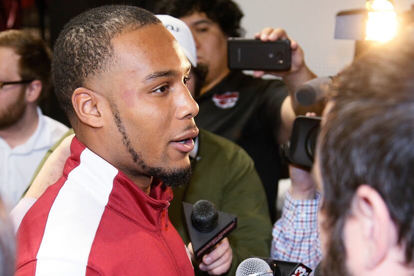 Oklahoma point guard Jordan Woodard talks with the media at a news conference in Norman,...