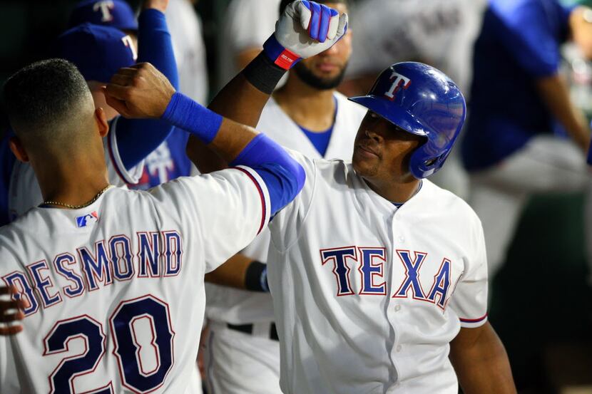 ARLINGTON, TX - AUGUST 26: Adrian Beltre #29 of the Texas Rangers is congratulated by Ian...