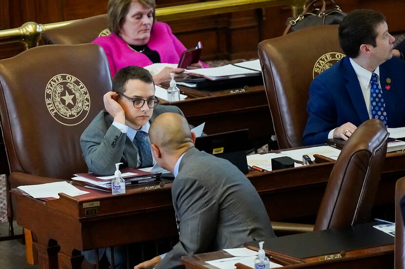 Rep. Briscoe Cain, R-Deer Park, (with glasses) talks with Rep. Cody Harris, R-Hillsboro...