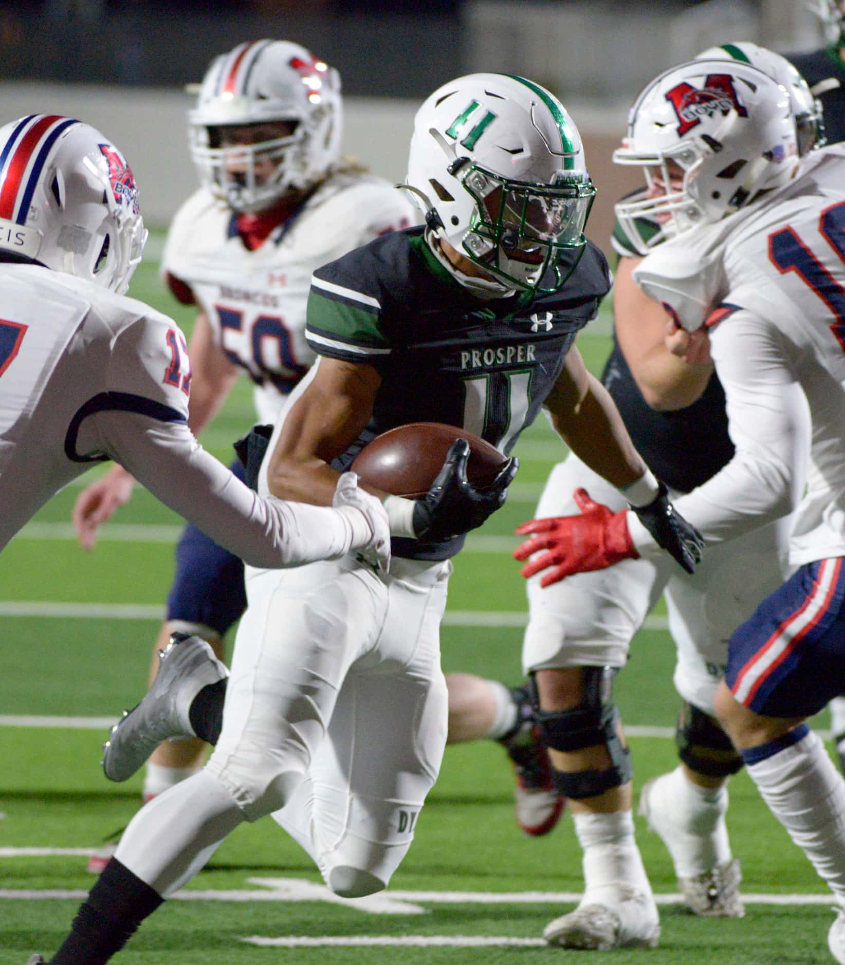 Prosper’s Noah Billings (11) looks for running room on a first half touchdown during a high...