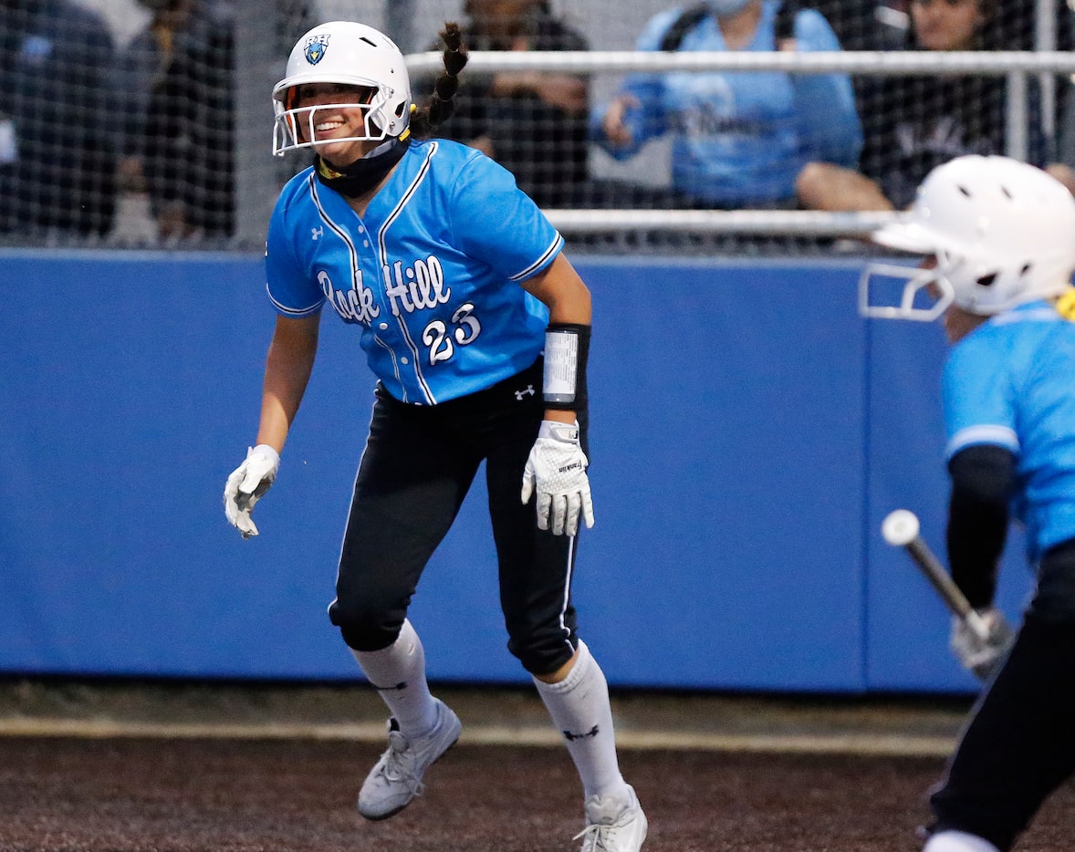 Rock HIll center fielder Emily Alvarez (23) steals home to give her team the lead in the...