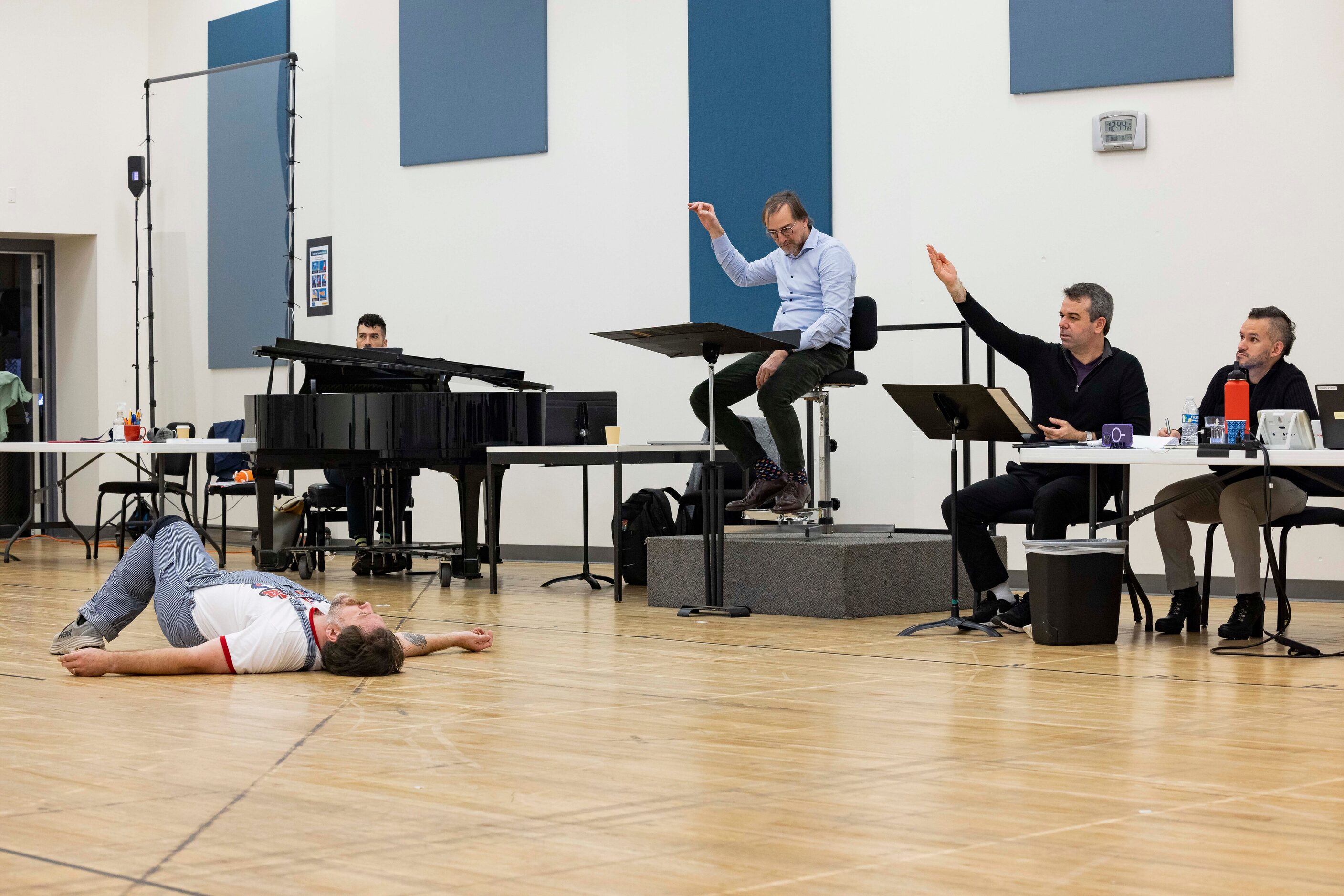 Director Tomer Zvulun (second to right) and assistant director Gregory Boyle (right) watch...