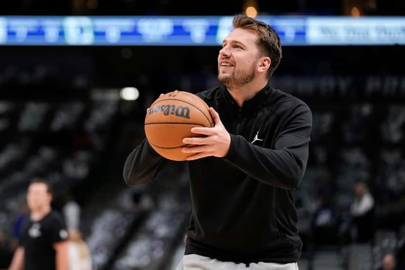 Dallas Mavericks guard Luka Doncic warms up for the team's NBA basketball game against the...