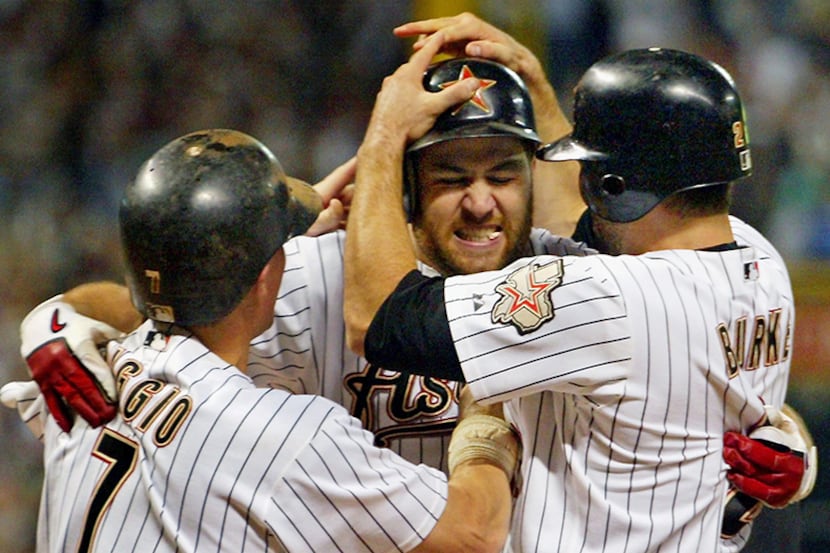  October 17, 2005--The Houston Astros' Lance Berkman is mobbed by teammates Craig Biggio...