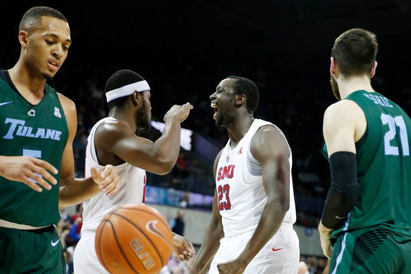 SMU Mustangs forward Akoy Agau (23) celebrates after making a basket and getting fouled by...