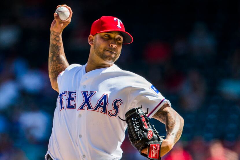 Texas Rangers relief pitcher Matt Bush (51) pitches during the eighth inning of their game...
