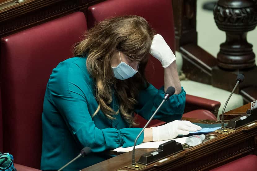 Italian lawmaker Maria Teresa Baladini wore a face mask and gloves during a session in...