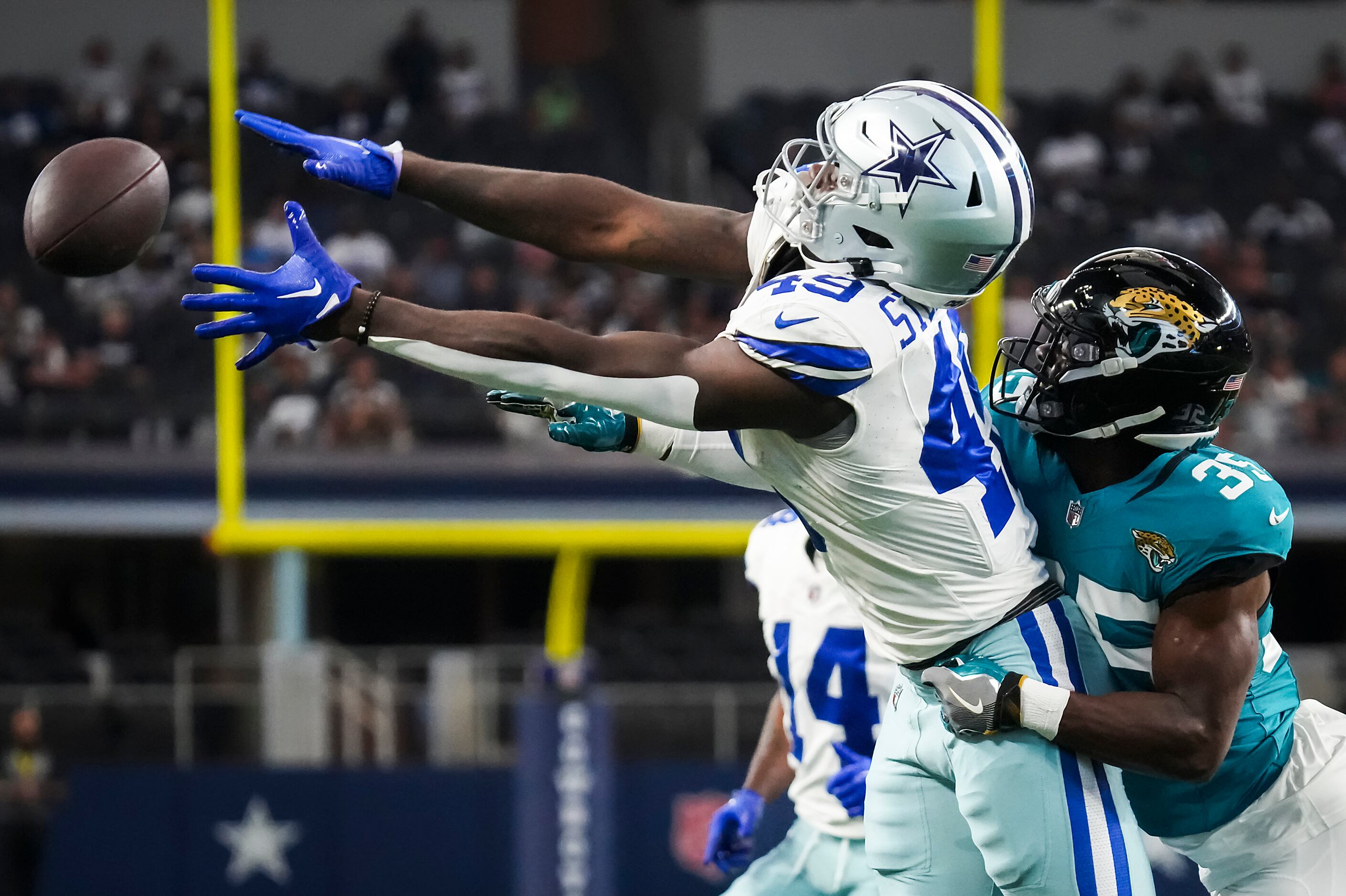 Dallas Cowboys wide receiver John Stephens Jr. (49) celebrates scoring a  touchdown during an NFL football