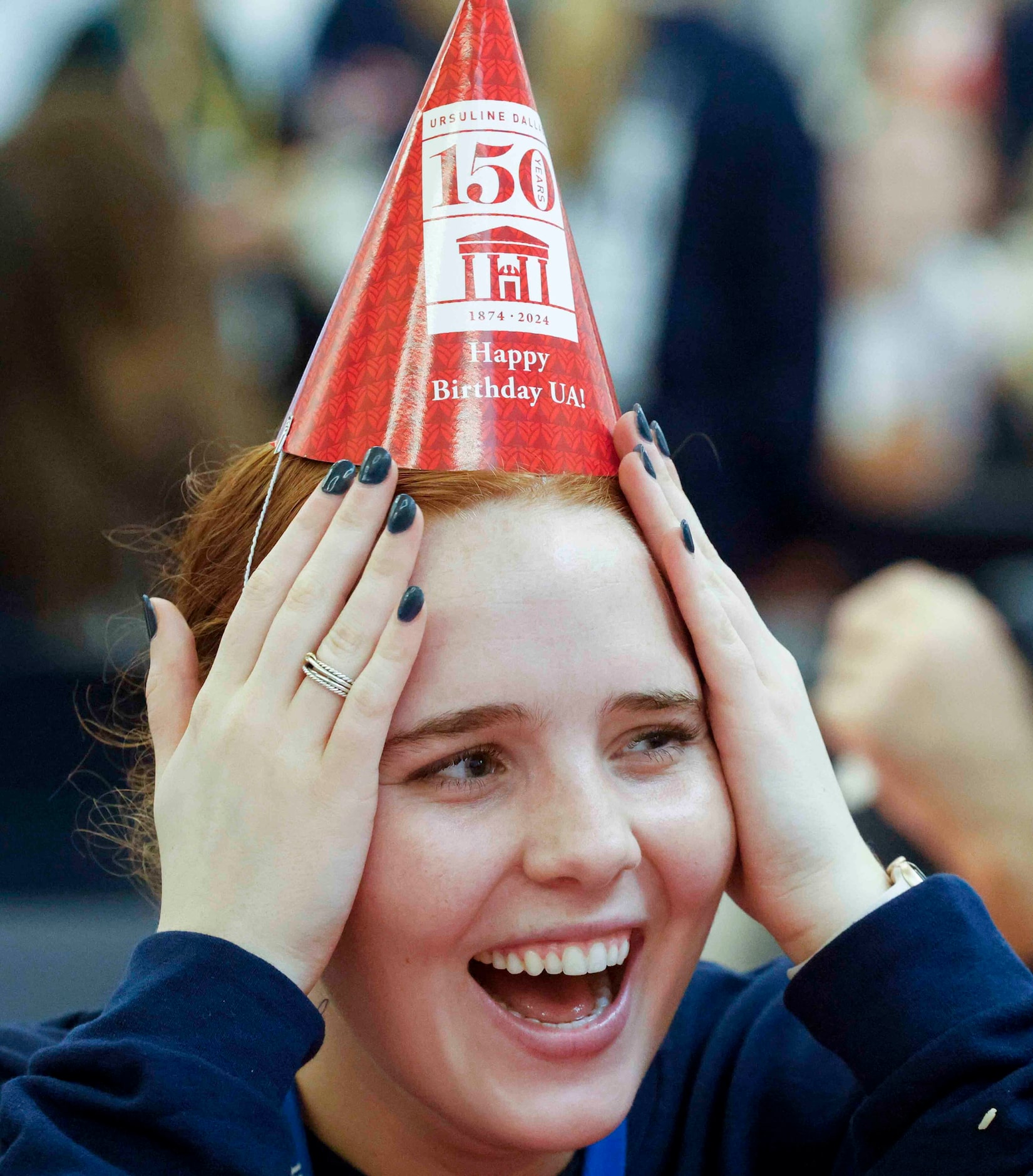 Senior Meredith Mallad reacts while talking to her friends over lunch during the 150th...