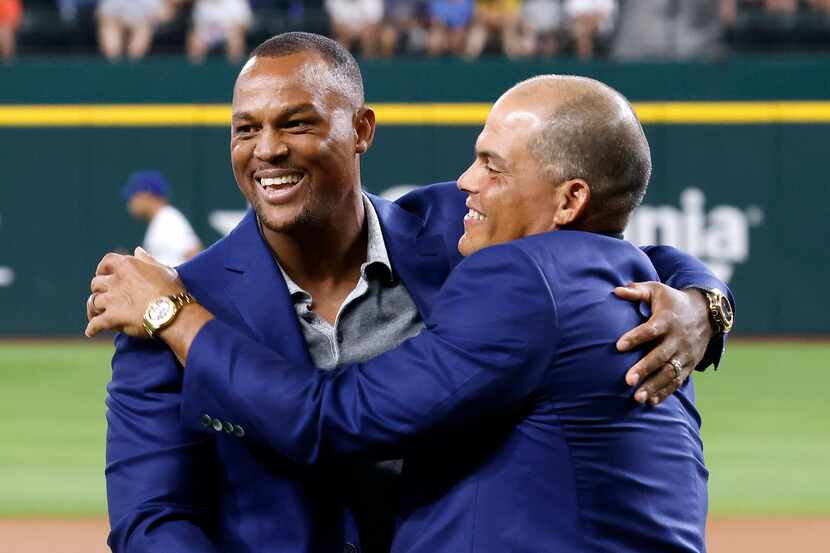 Former Texas Rangers third baseman Adrian Beltre (left) is congratulated by former Rangers...