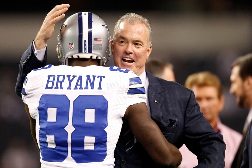 Dallas Cowboys executive vice president Stephen Jones hugs Dallas Cowboys wide receiver Dez...