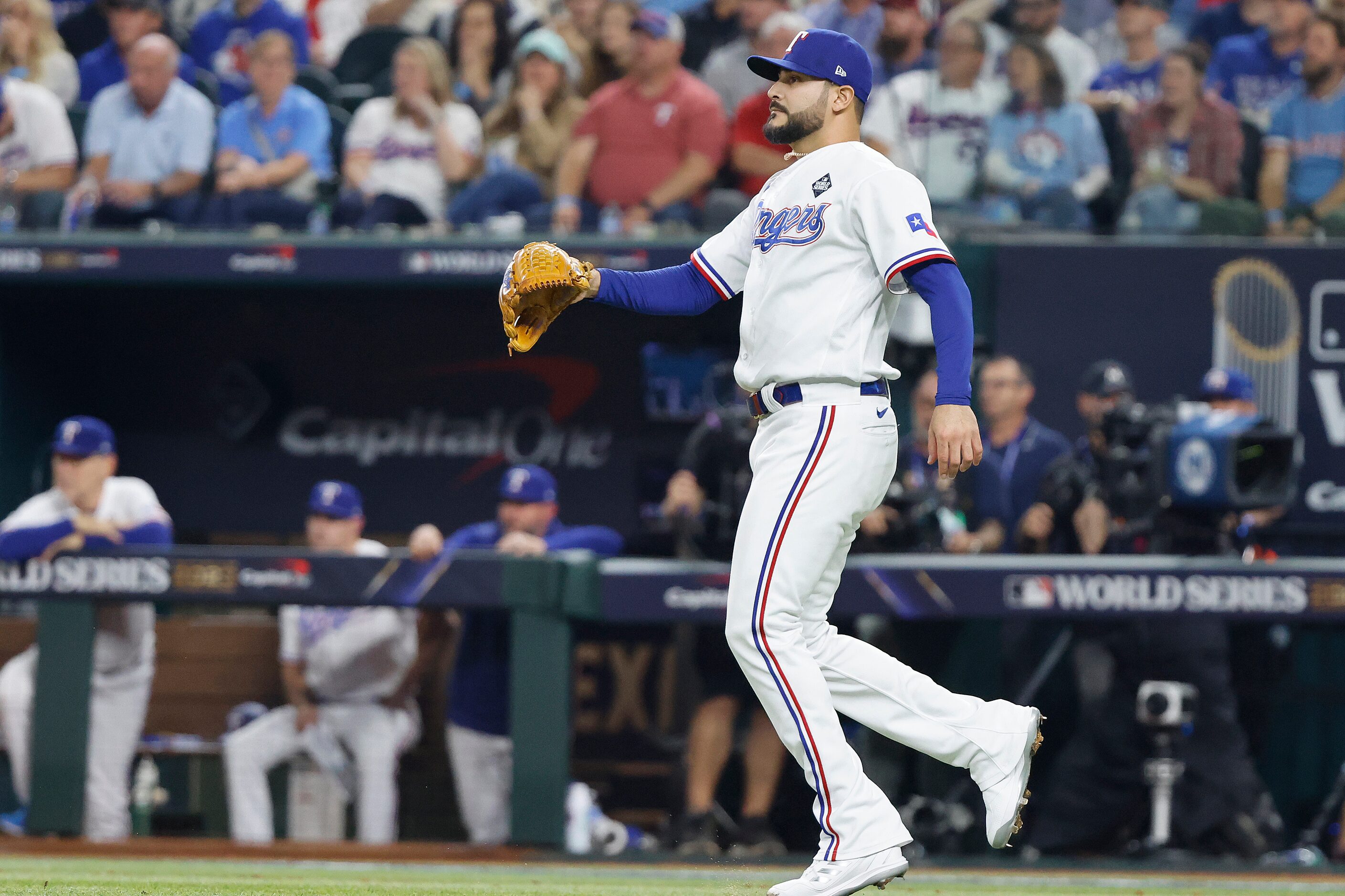 Texas Rangers pitcher Martin Perez reacts after giving up a two-run single to Arizona...