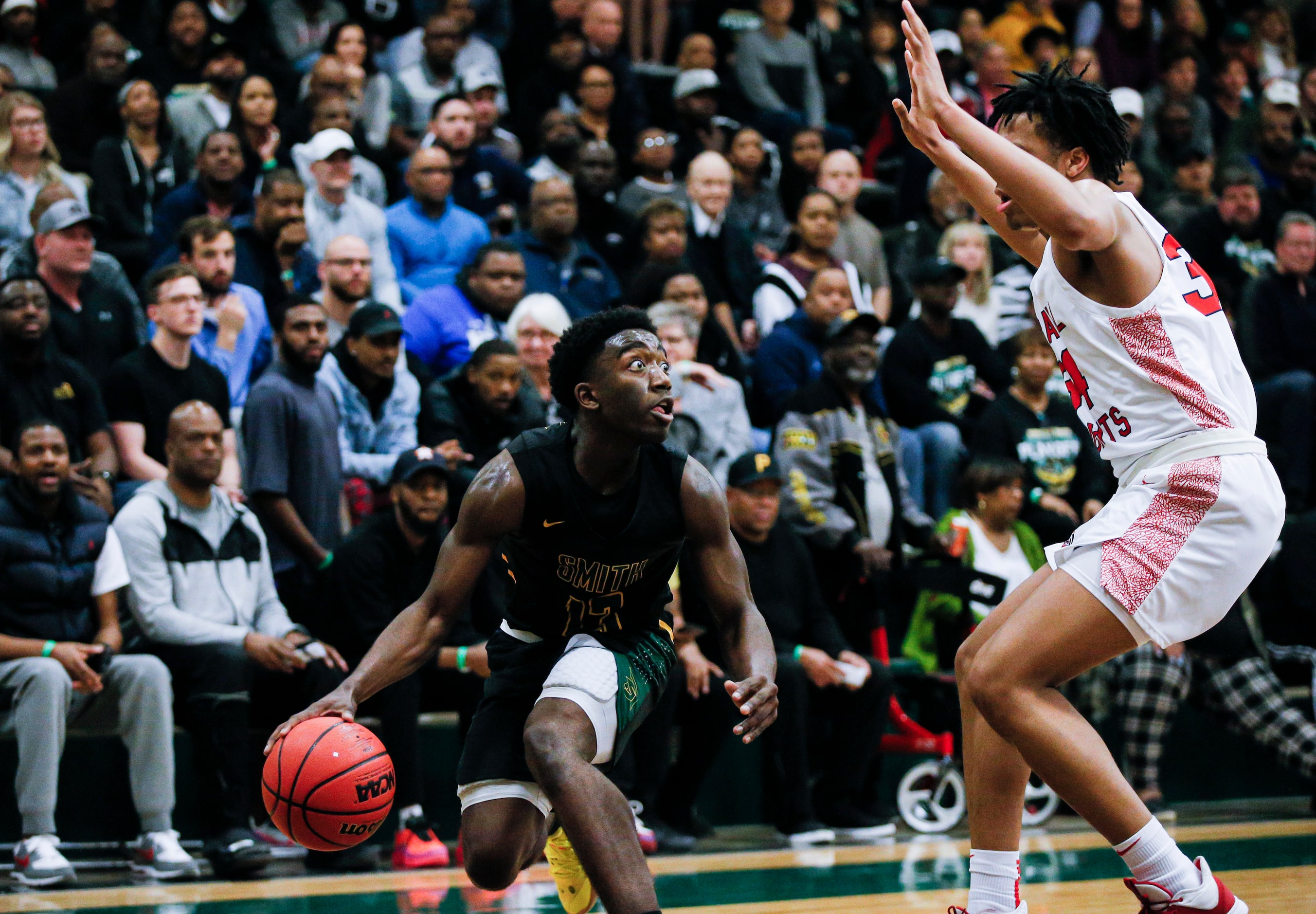 Newman Smith senior Bobby Smith III (13) looks for room against Kimball junior Corey Flowers...