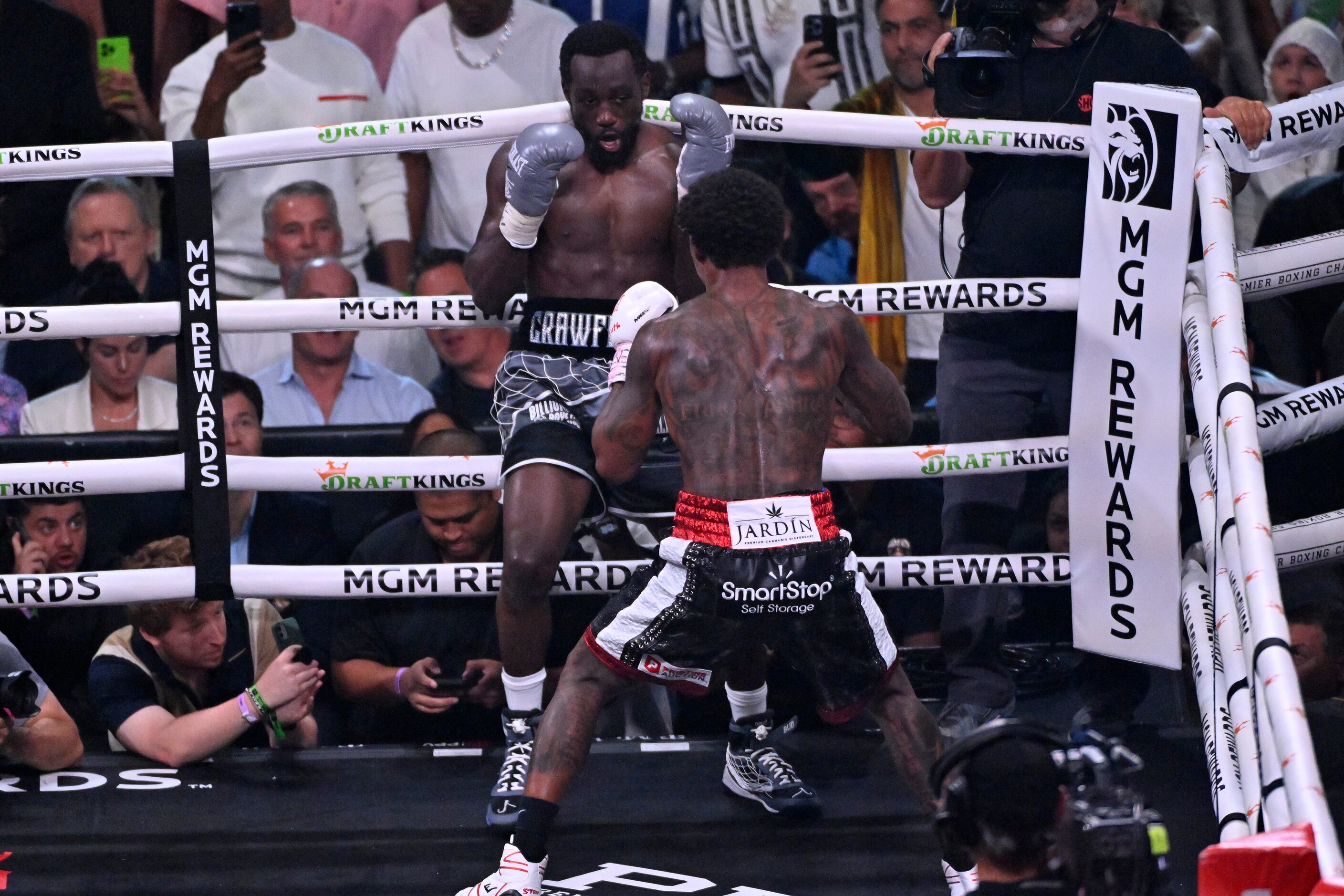 Errol Spence Jr., right, and Terence Crawford fight during their undisputed welterweight...