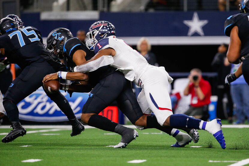 Denton Ryan's defensive lineman Ja'Tavion Sanders (1) sacks Alvin Shadow Creek's quaterback...