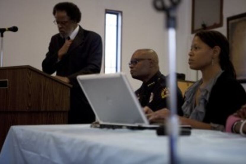  Police Chief David Brown listens to community members during a December 2010 meeting about...