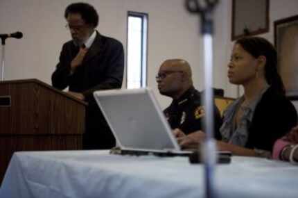  Police Chief David Brown listens to community members during a December 2010 meeting about...