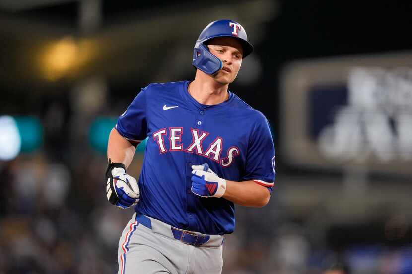 Texas Rangers' Corey Seager runs the bases on a three-run home run against the Los Angeles...