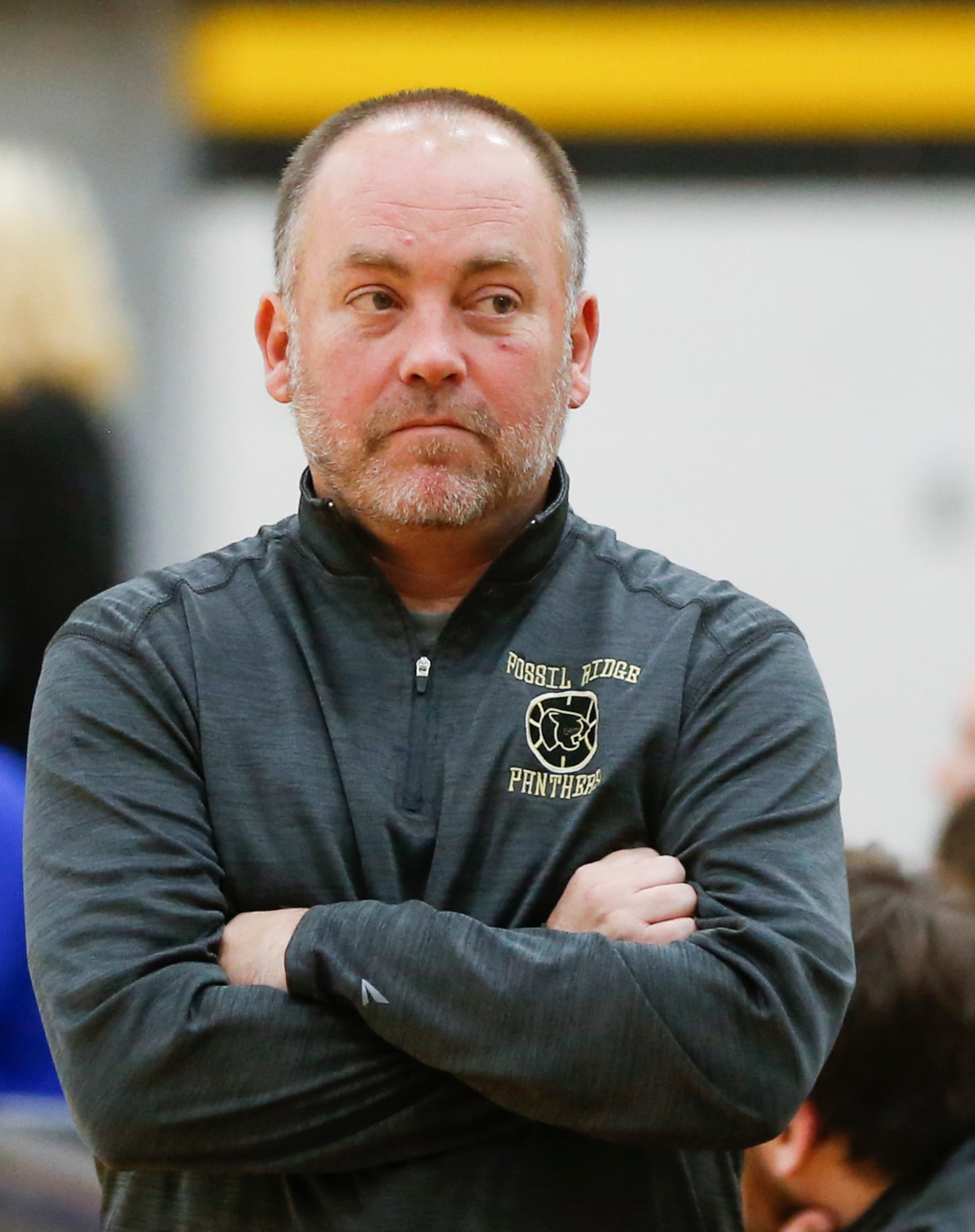 Fossil Ridge High School head coach Zack Myers looks at the bench during the fourth quarter...