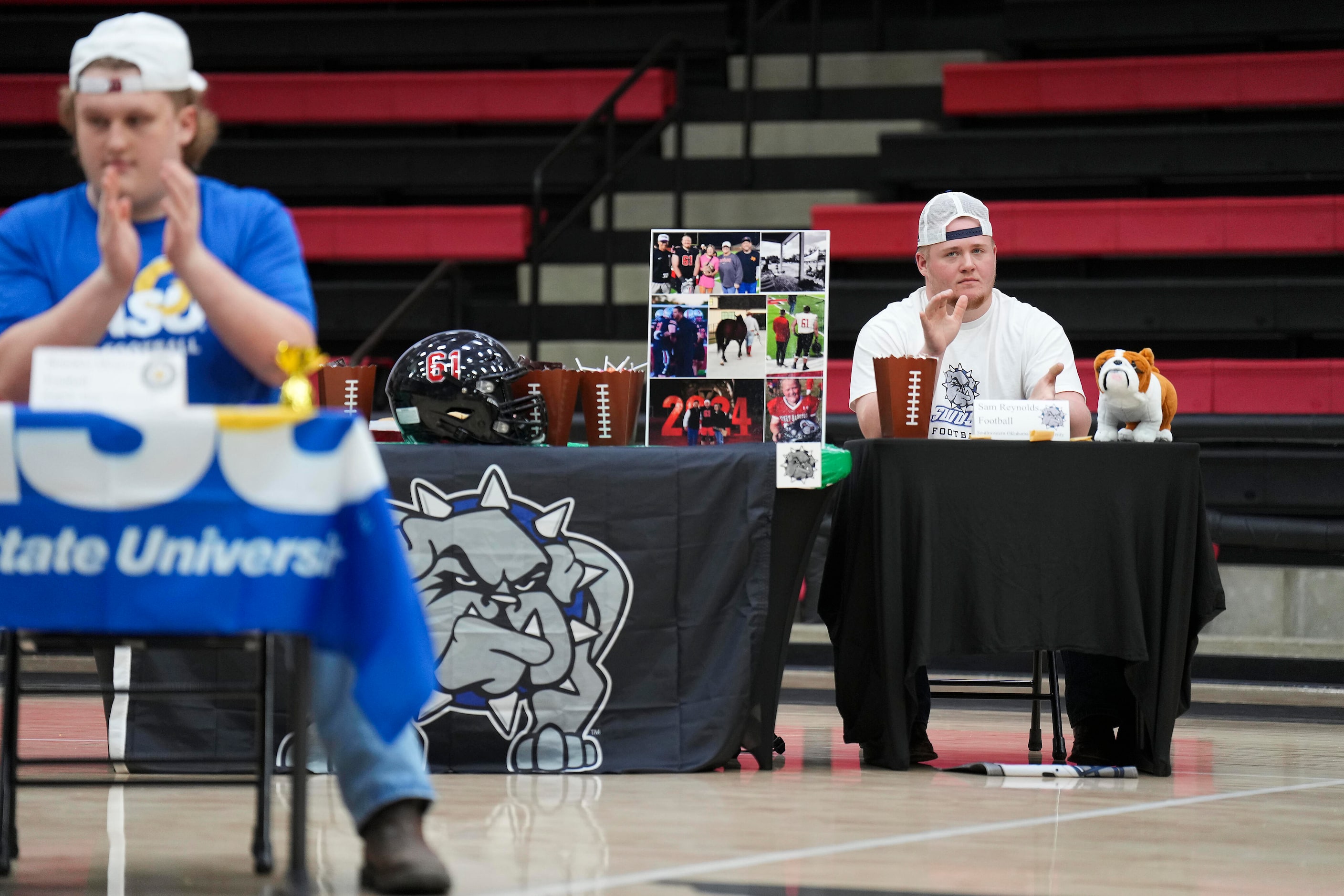 Lovejoy all-state offensive lineman Sam Reynolds applauds comments about a teammate during a...