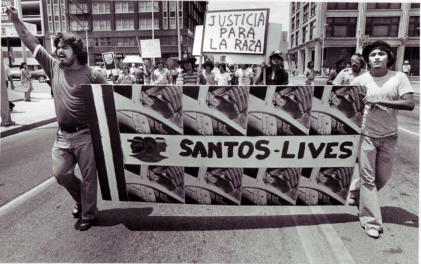 Demonstrators held a banner honoring Santos Rodriguez as they marched for racial justice in...
