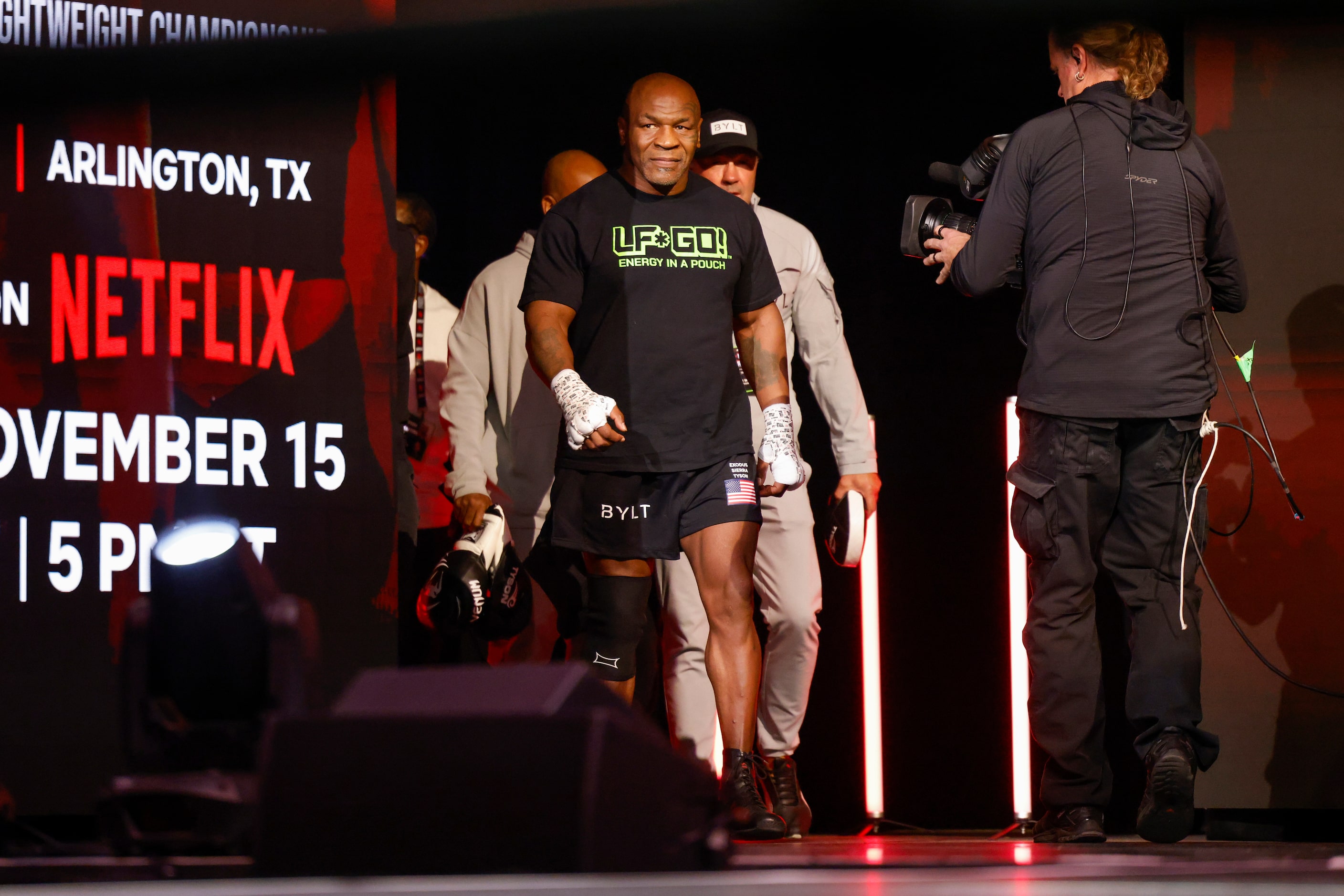 Mike Tyson walks on stage during an open workout ahead of his upcoming boxing bout against...