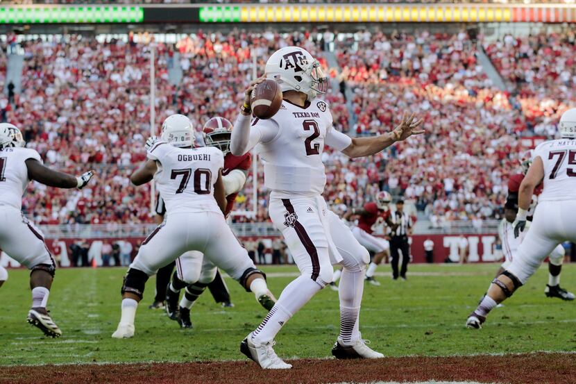 In this Nov. 10, 2012, file photo, Texas A&M quarterback Johnny Manziel (2) throws from the...