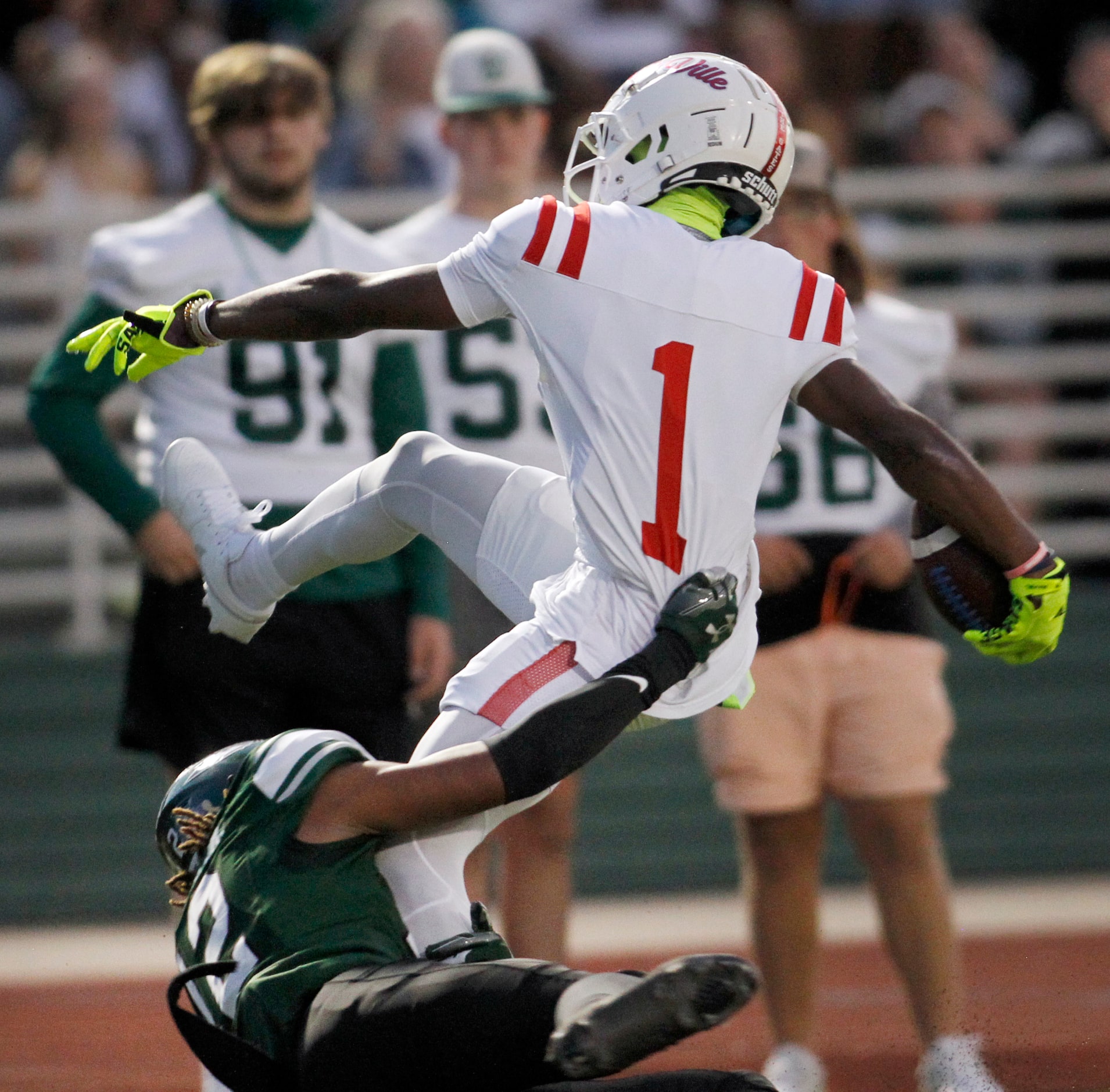 Duncanville receiver Dakorien Moore (1) is tackled by Waxahachie defensive back Michael...