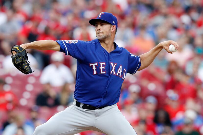 CINCINNATI, OH - JUNE 15: Mike Minor #23 of the Texas Rangers pitches in the second inning...