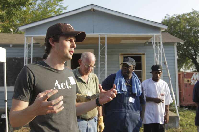 ACT founder and president Reid Porter talks to some of the volunteers at the  demolition of...