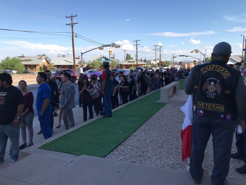 People stand in line waiting for the viewing on Friday evening.