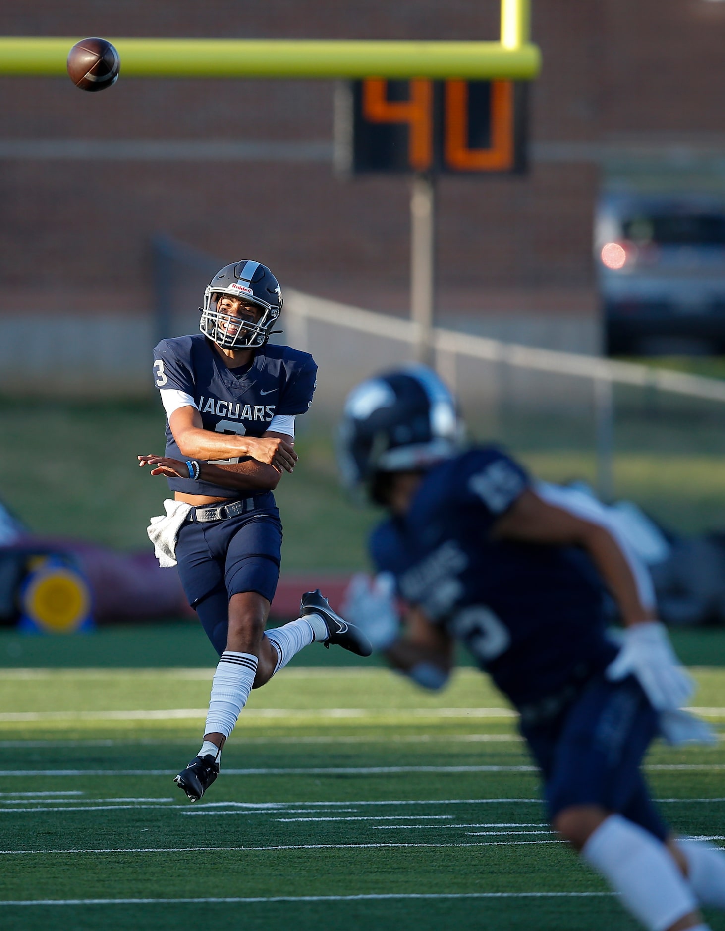 Flower Mound senior quarterback Nick Evers (3) throws to junior wide receiver Walker Mulkey...