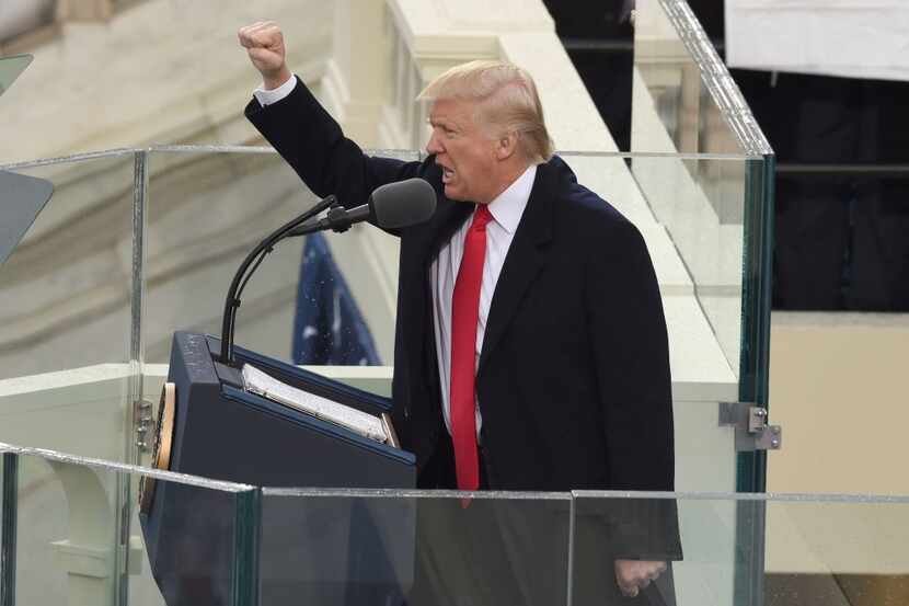 President Donald Trump salutes the crowd after the swearing-in ceremony as 45th President of...