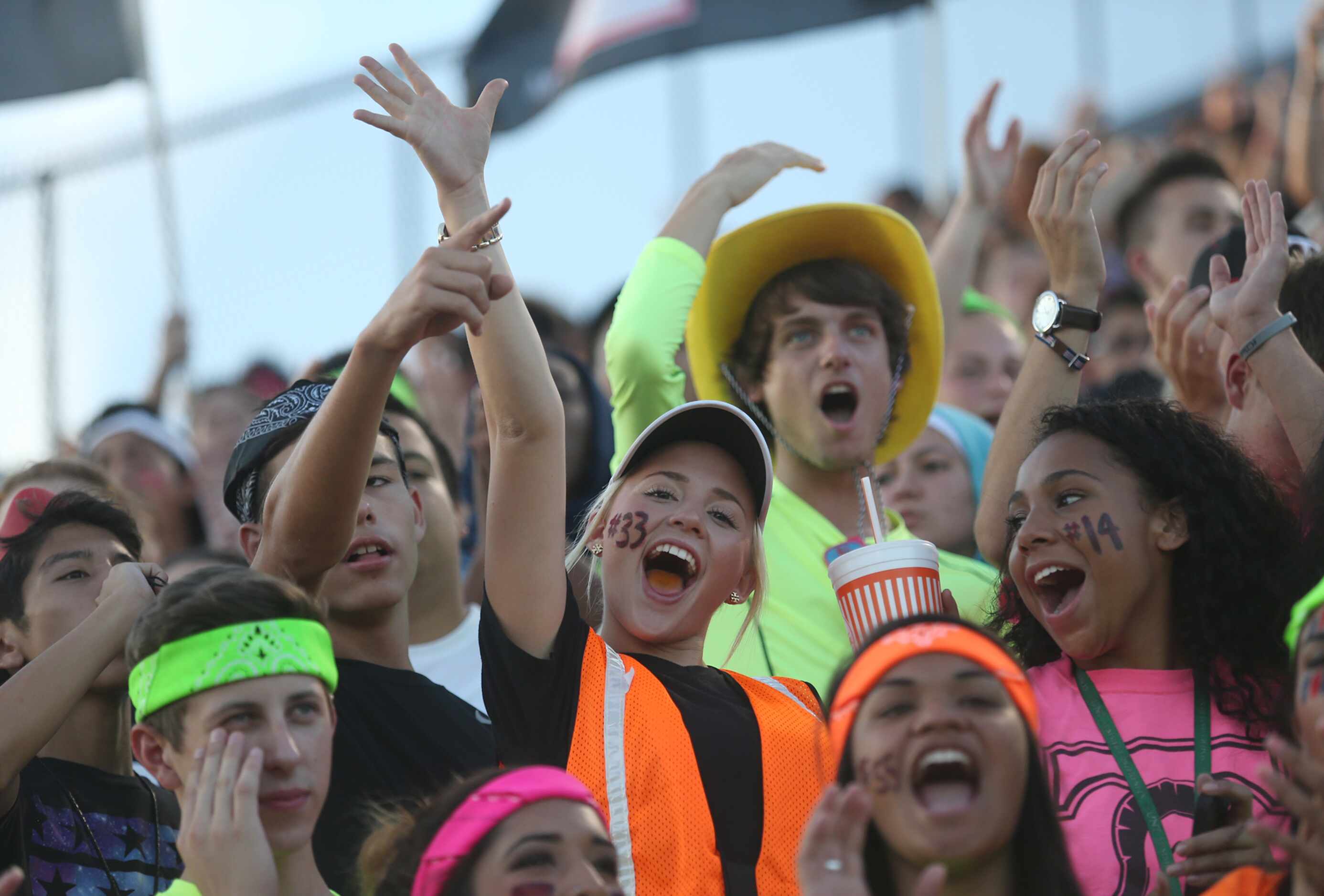 Trinity High School fans celebrates a second quarter touchdown in game action between Euless...