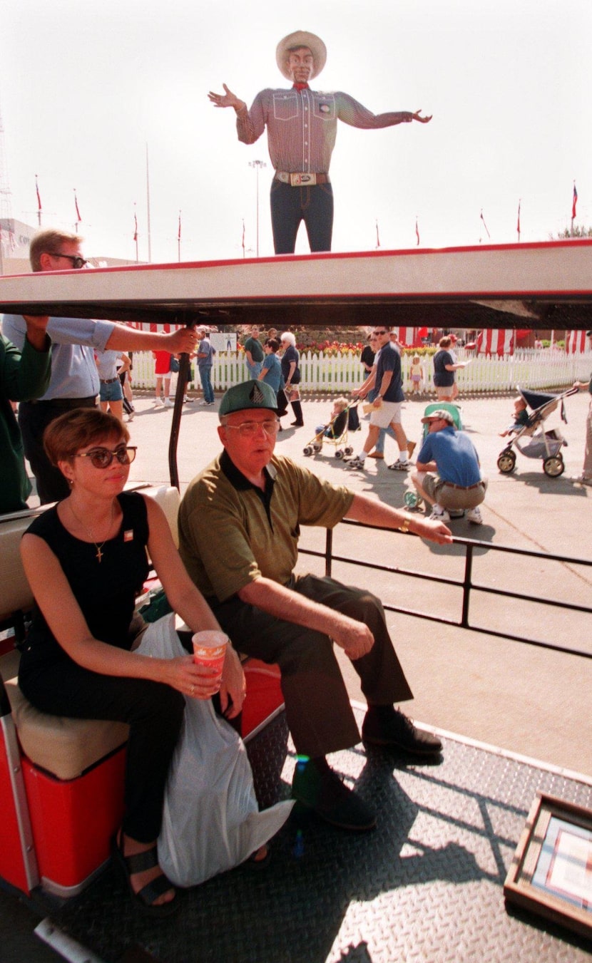 Former Soviet Union President Mikhail Gorbachev and his daughter Irina cruise past 'Big Tex'...